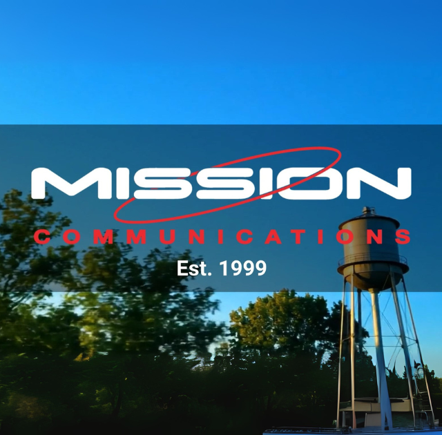 Mission Communications logo with a water tower and trees in the backdrop with a clear blue sky